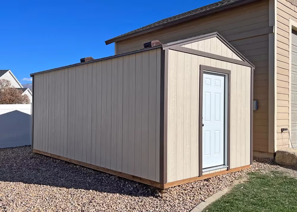 A 10 foot by 20 foot tall apex storage shed with a steel entry door
