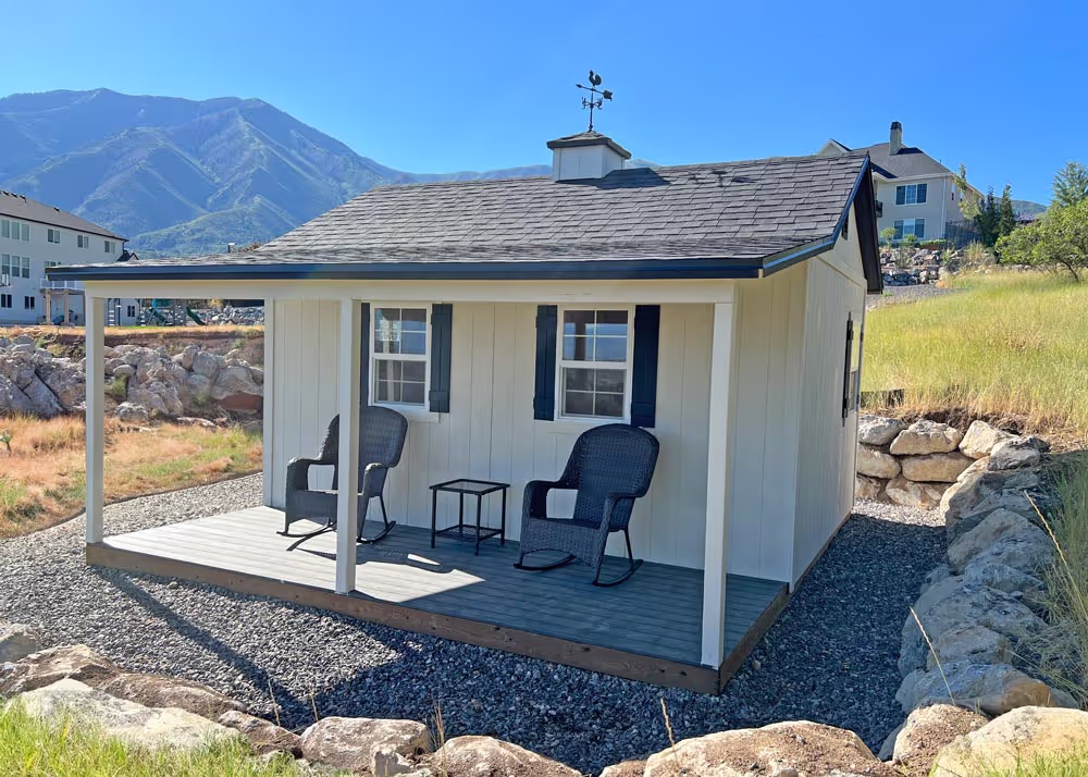 A 12 foot by 16 foot tall apex shed with a porch overhang, deck and more