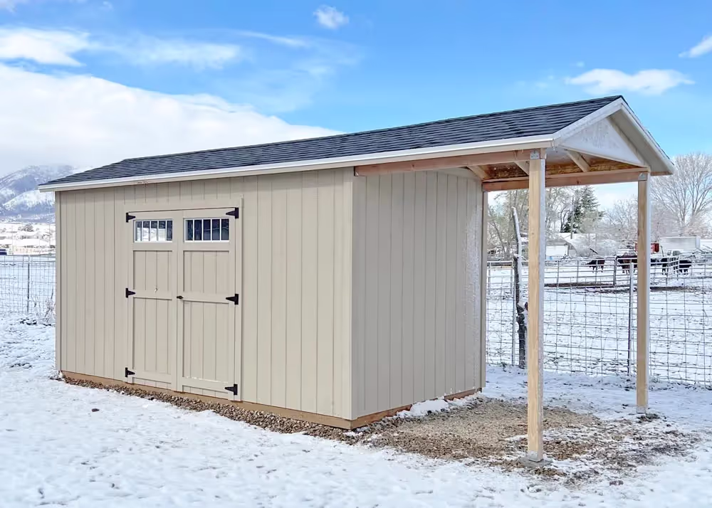 An 8' x 16' Tall apex with a roof extension and transom windows in the doors