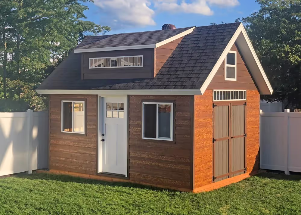 A custom 12x16 tall apex shed with custom lap siding and a dormer