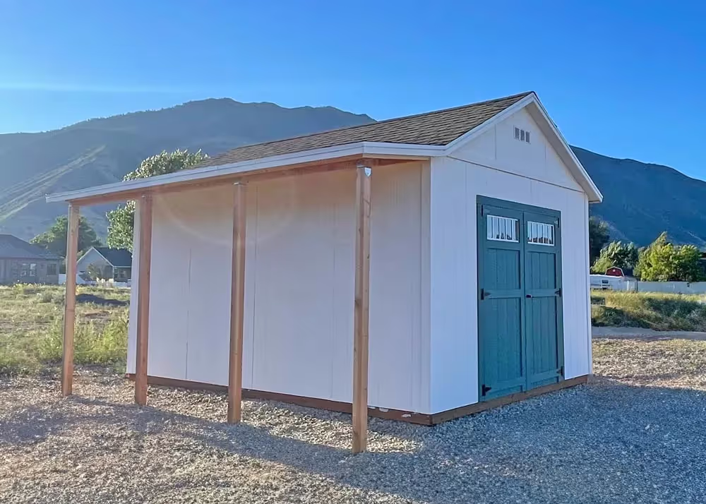A 12' x 16' Tall Apex shed with a porch overhang and transom windows in the double door