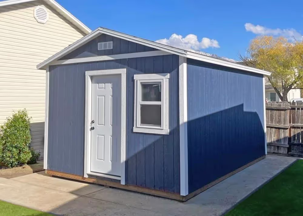 A 12 foot by 16 foot Tall Apex shed with a steel entry door and a window