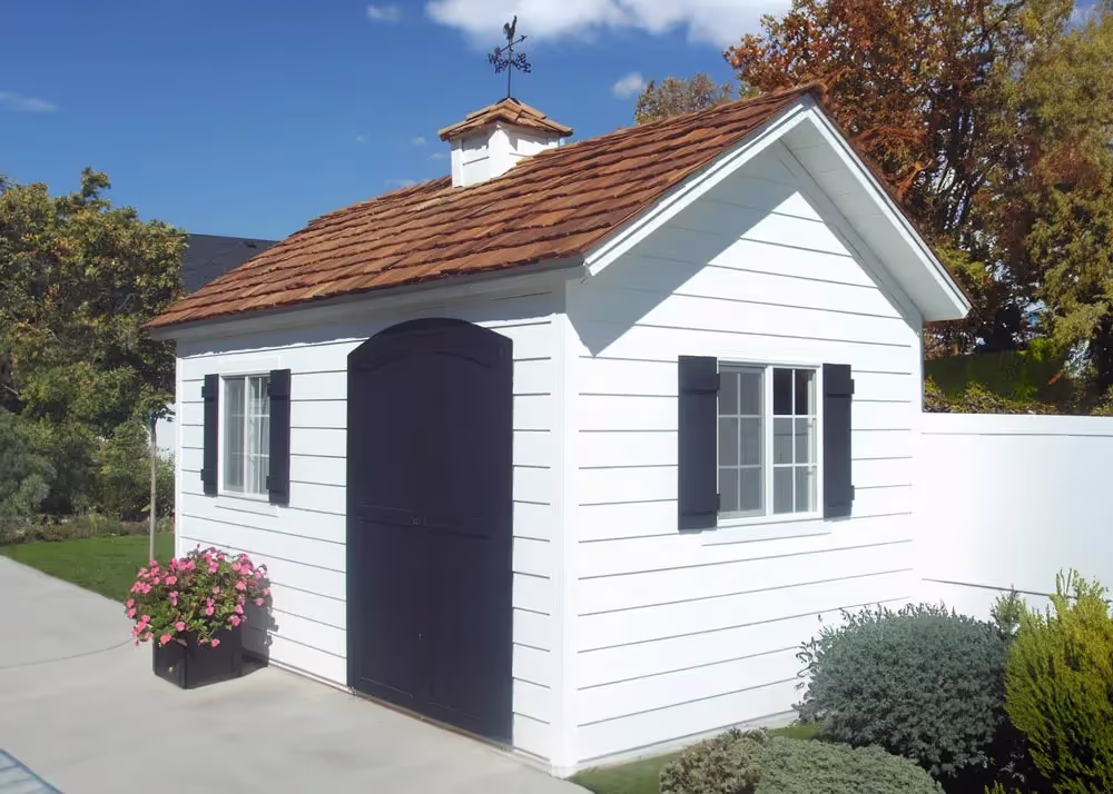 An 8 foot by 16 foot Tall Apex shed with custom lap siding, a custom roof pitch and cedar shake shingles
