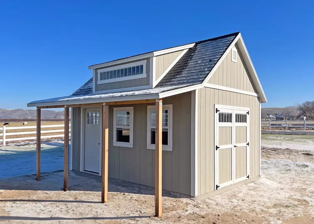 A custom 12 foot by 16 foot Tall Apex shed with a dormer, a porch overhang and more...