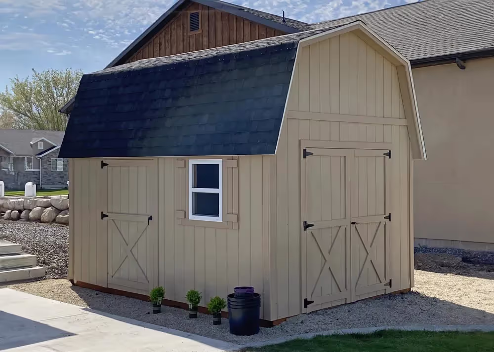 A 10 foot by 14 foot Standard barn with 6 inch roof overhang and custom trim on the door