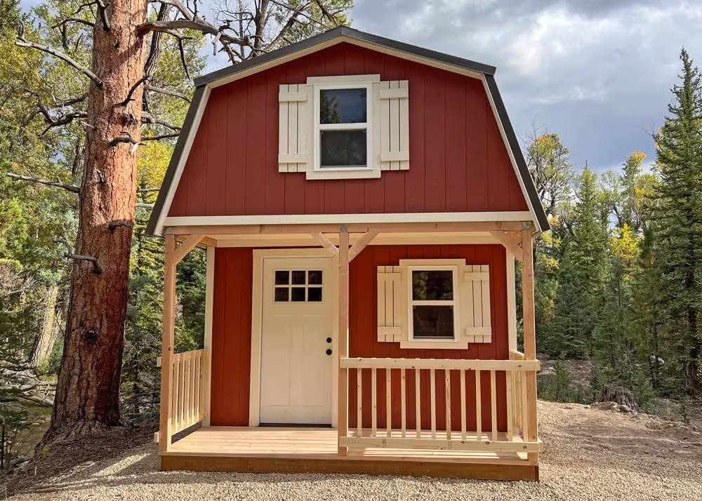 A 12 foot by 20 foot Custom Tall Barn shed with a loft over the porch, porch railing and a lot more...