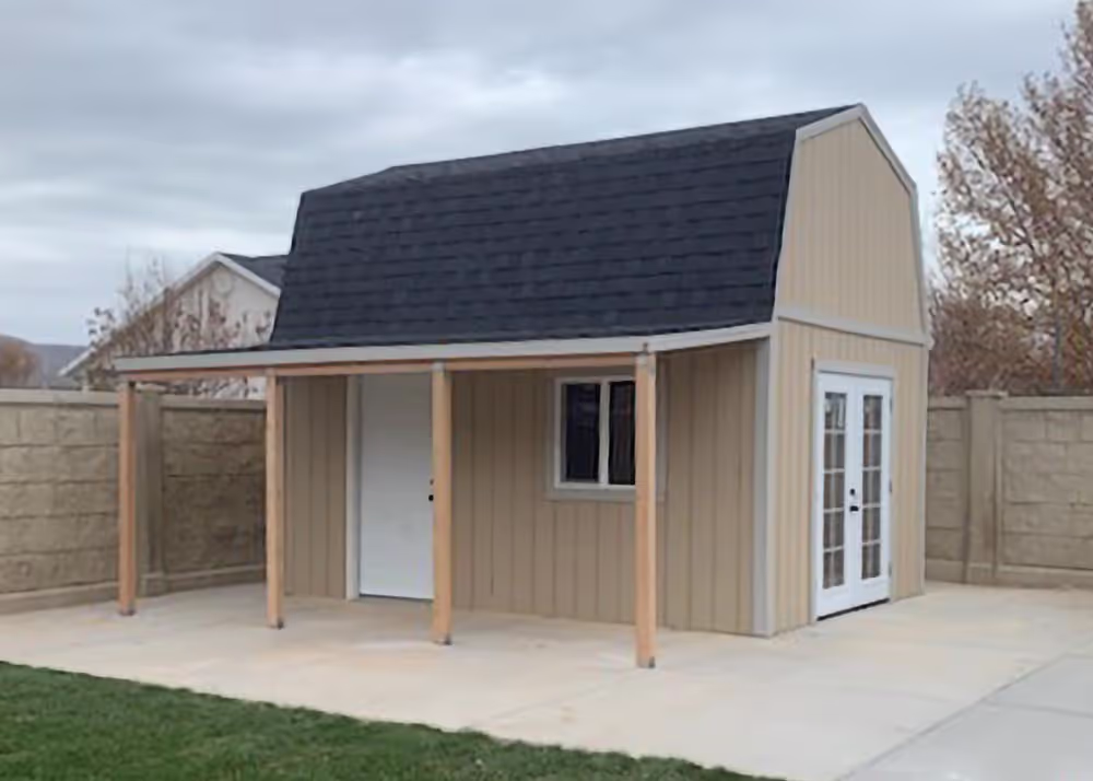 A 12 foot by 16 foot tall barn shed with a porch overhang and french doors