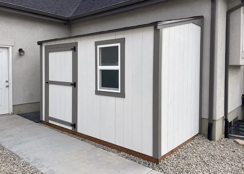 A 6 foot by 12 foot Lean-To Shed up against the wall of a house