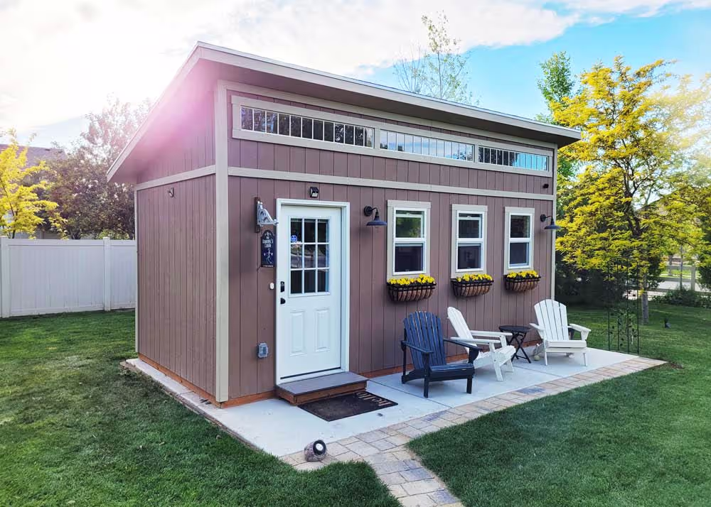 A custom 10 foot by 20 foot Tall lean-to shed used as a backyard office
