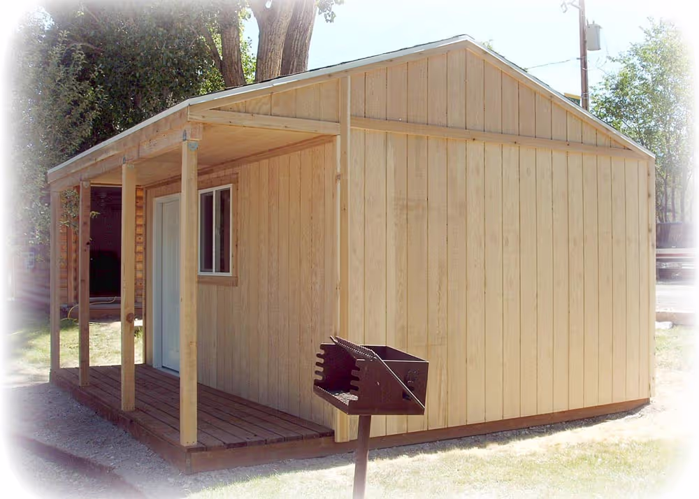A 14 foot by 16 foot Tack style cabin shed with T-111 wood siding