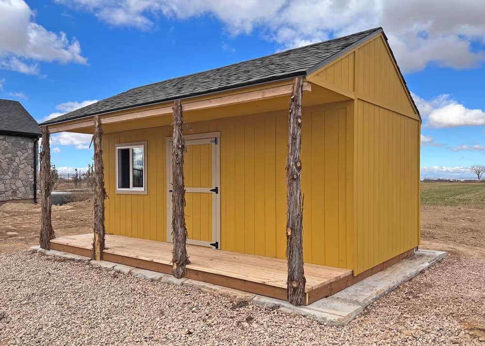 A 14 foot by 20 foot Tack shed with a custom roof pitch and cedar posts