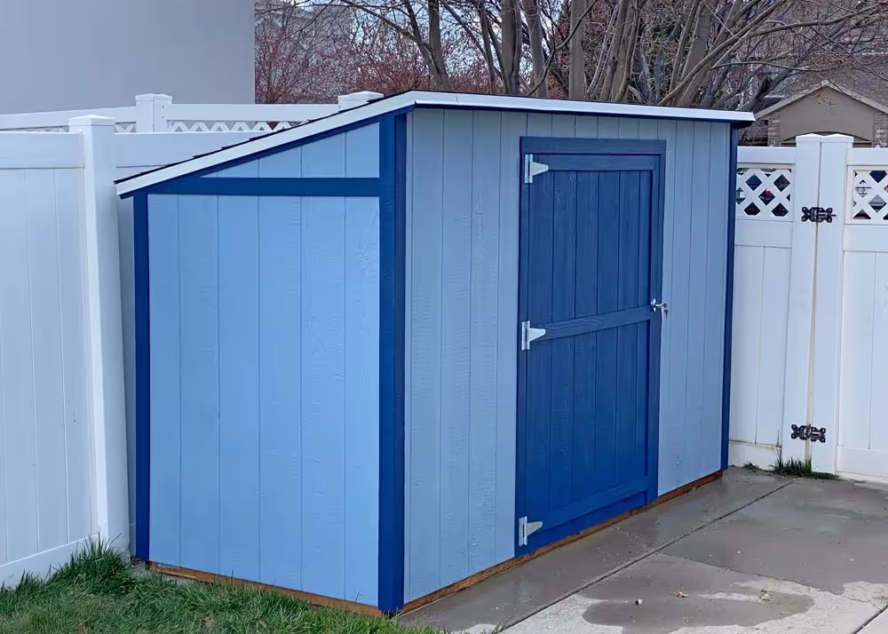 A blue 4 foot by 10 foot Yard Hutch storage shed