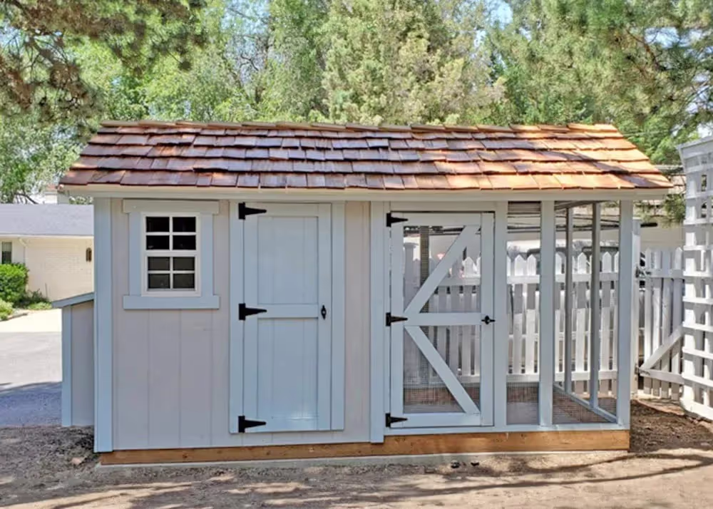 6 foot by 12 foot Coop De'Ville Chicken coop with cedar shake roof