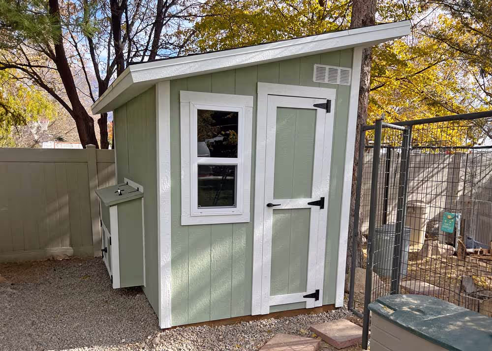 A custom Lean-To Shed converted into a chicken coop with nesting boxes