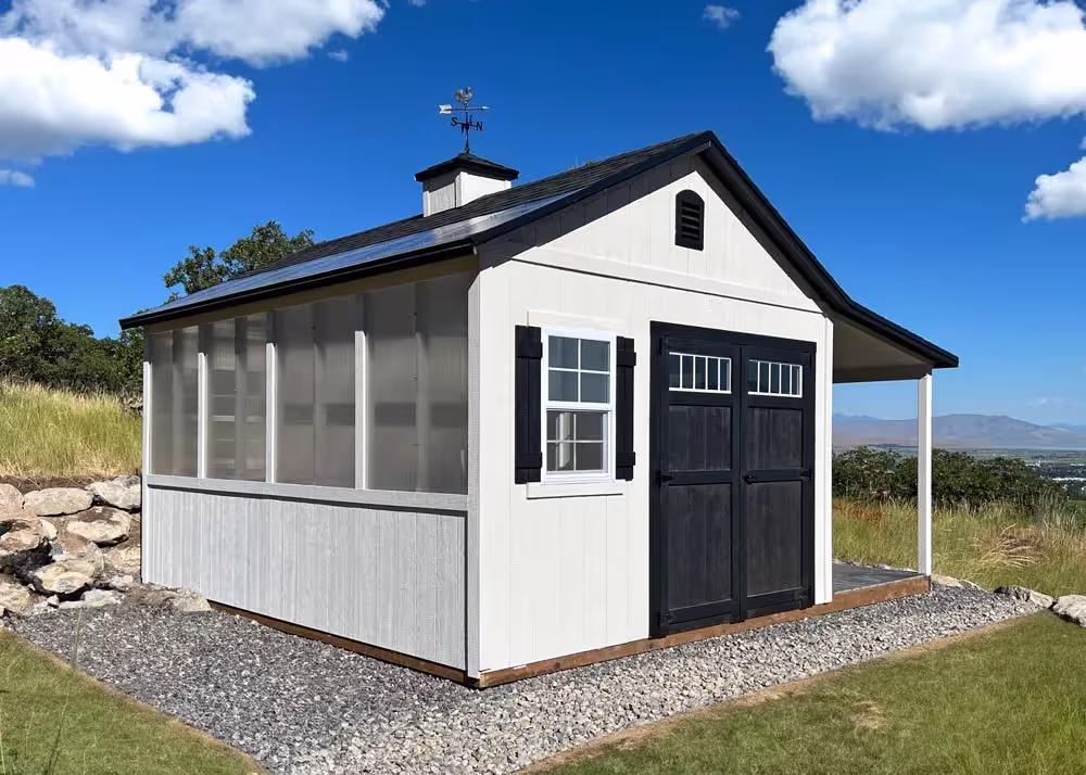 A custom Shed and Greenhouse Combination with a porch overhang and a cupola