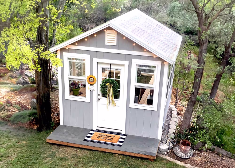 A 10 foot by 10 foot Greenhouse shed with Corrugated polycarbonate roofing