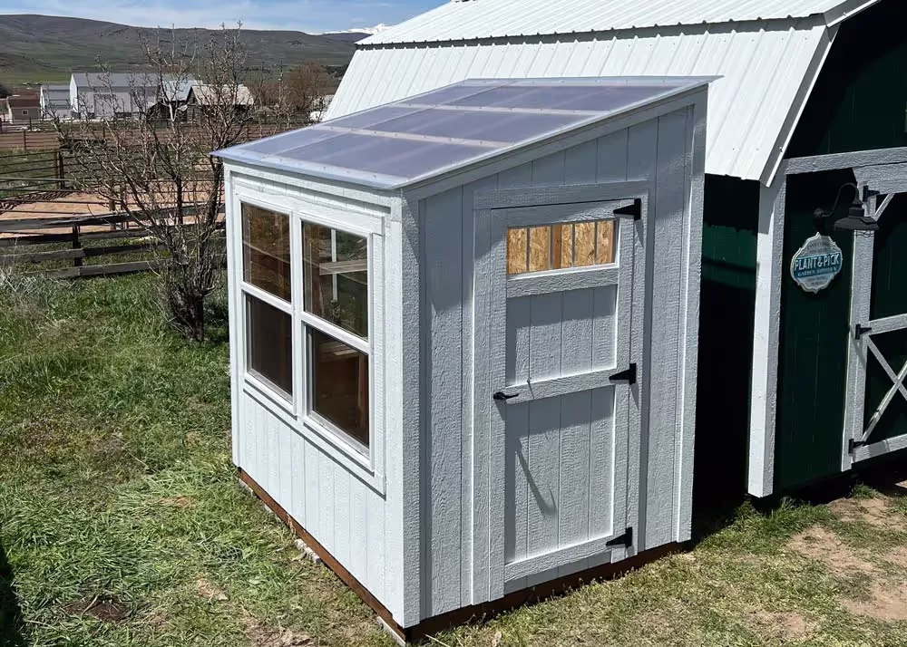 A 6 foot by 8 foot Lean-To Style Greenhouse shed