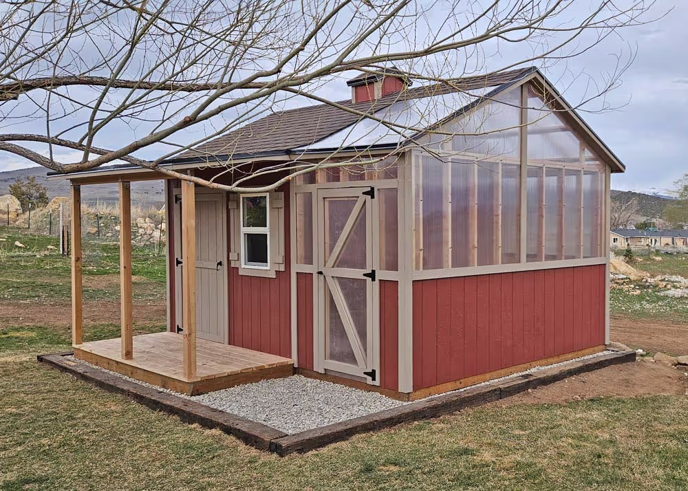 A very custom 12 foot by 16 foot shed and greenhouse combo with a porch