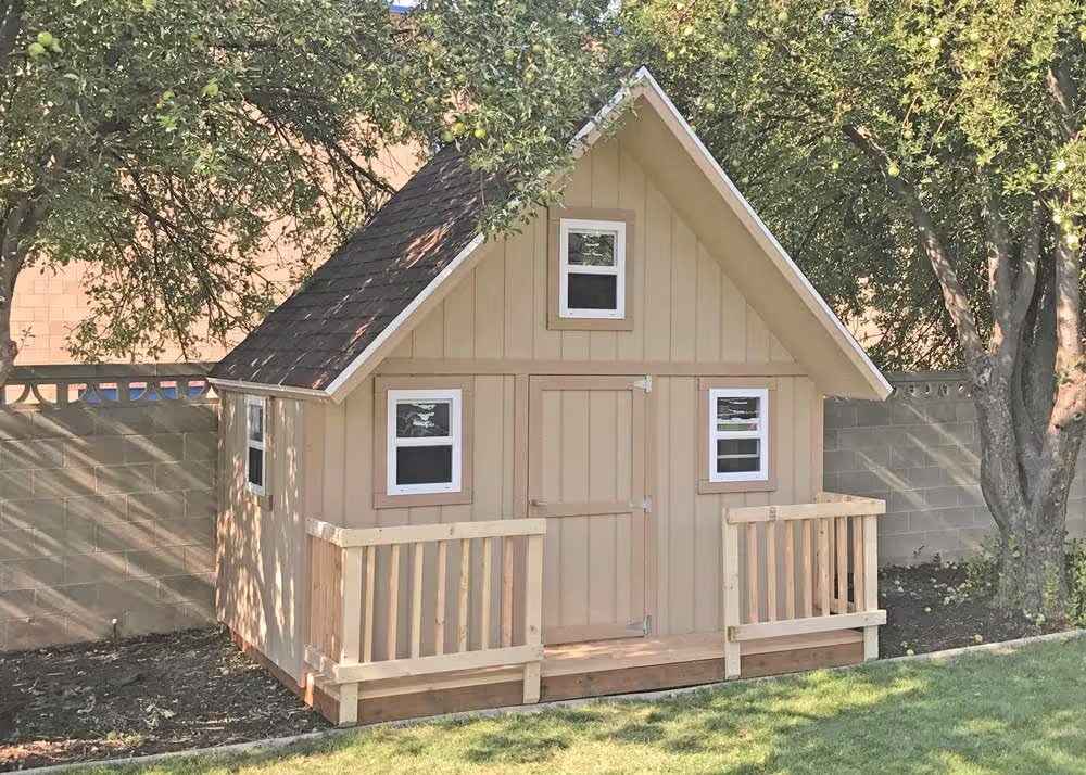 A 12 foot by 10 foot Clubhouse Playhouse with porch railing and extra windows
