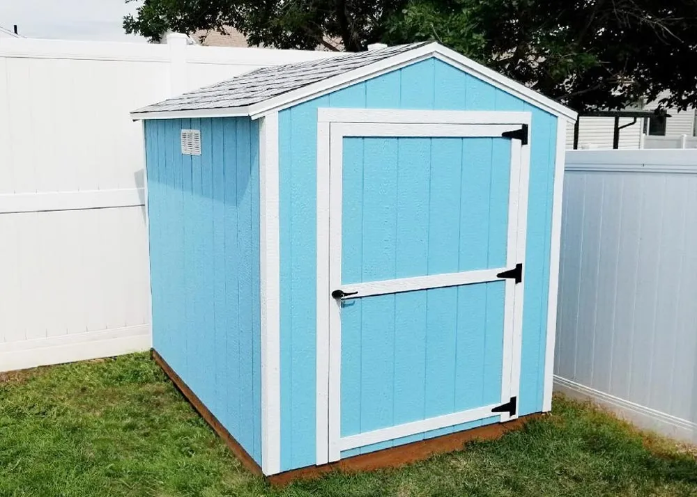 A light blue and white 6 foot by 8 foot Value Apex economy storage shed