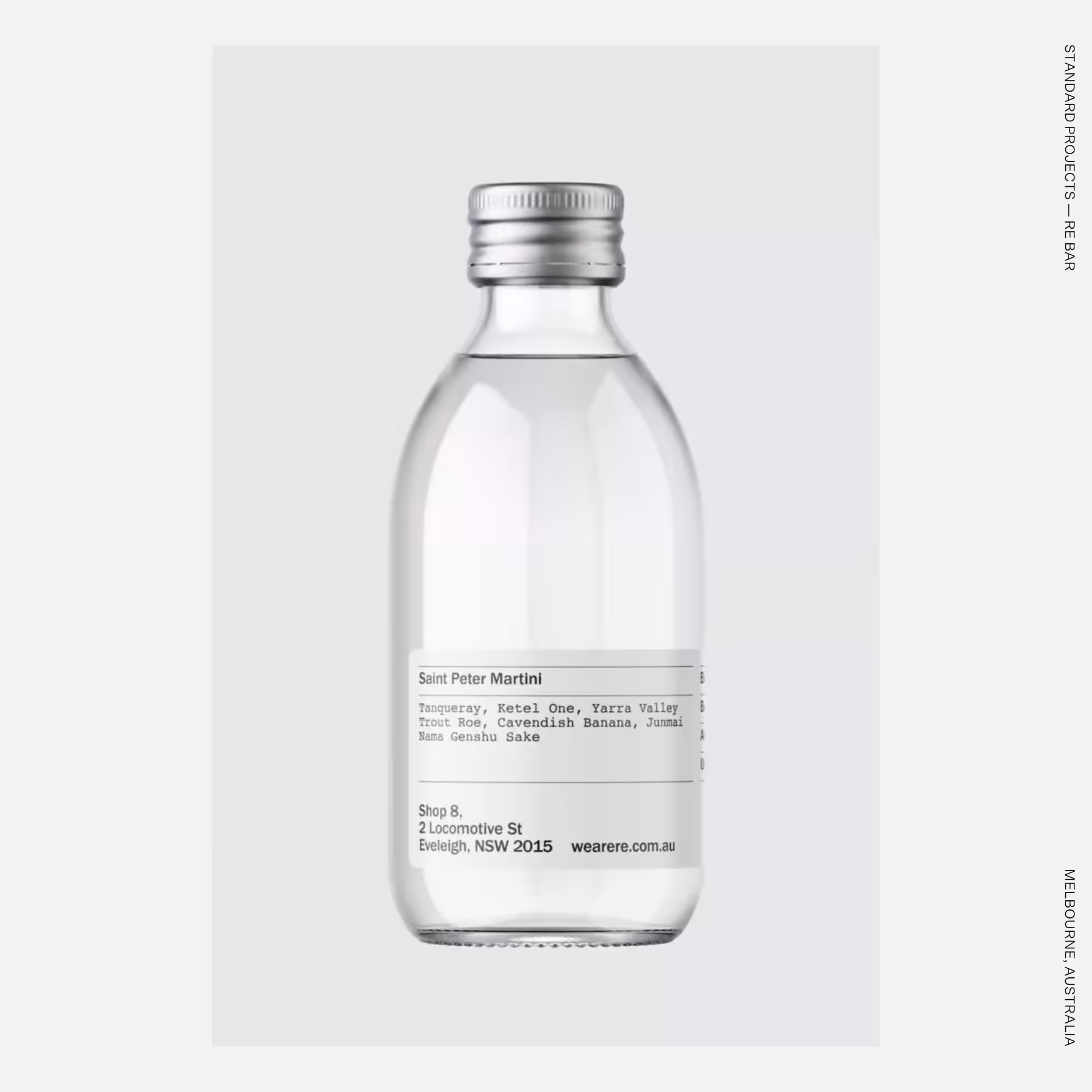 Minimalist clear sake bottle with utilitarian type.