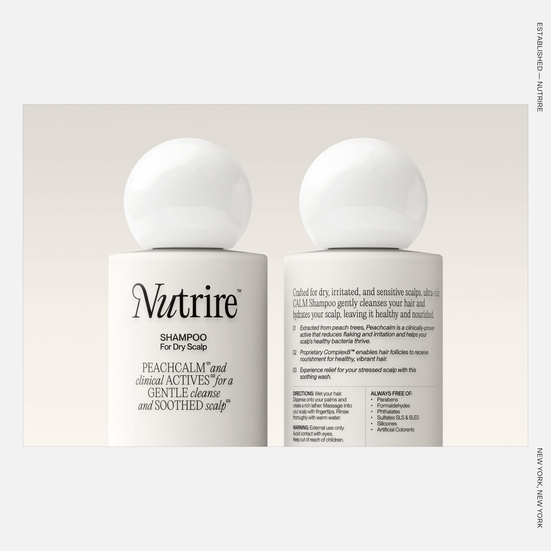 Minimalist shampoo bottles with spherical caps and refined black typography on matte white packaging for Nutrire.