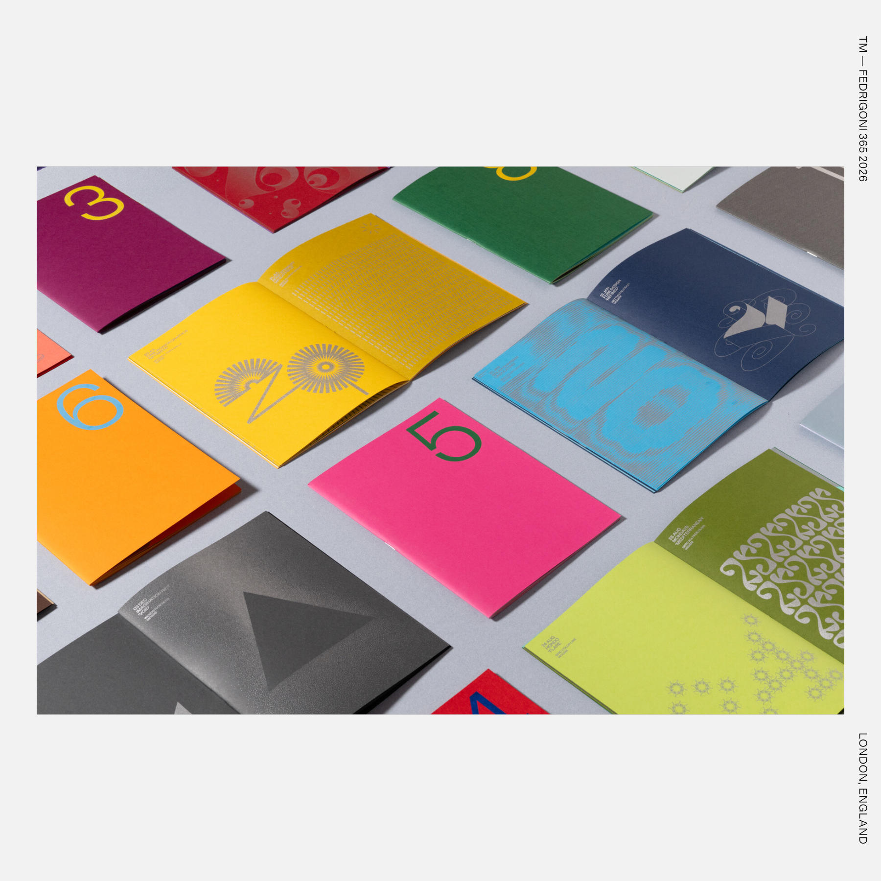 2. Colorful open booklets laid out in a grid, each featuring bold numbers and abstract graphic patterns.