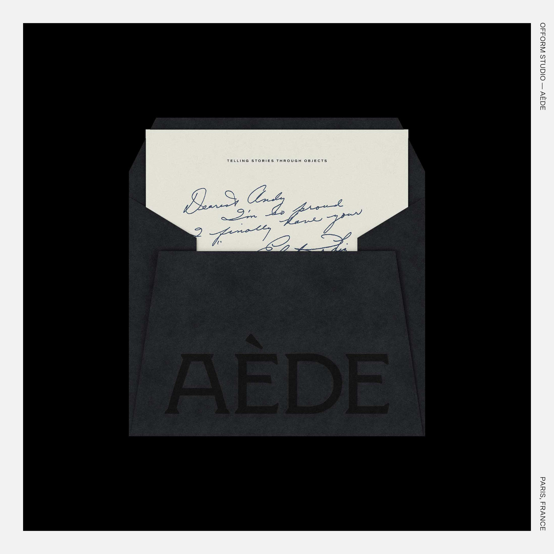 Black envelope with AÈDE logo holding a handwritten note card reading “Dearest Andy…,” under the tagline “Telling Stories Through Objects.”