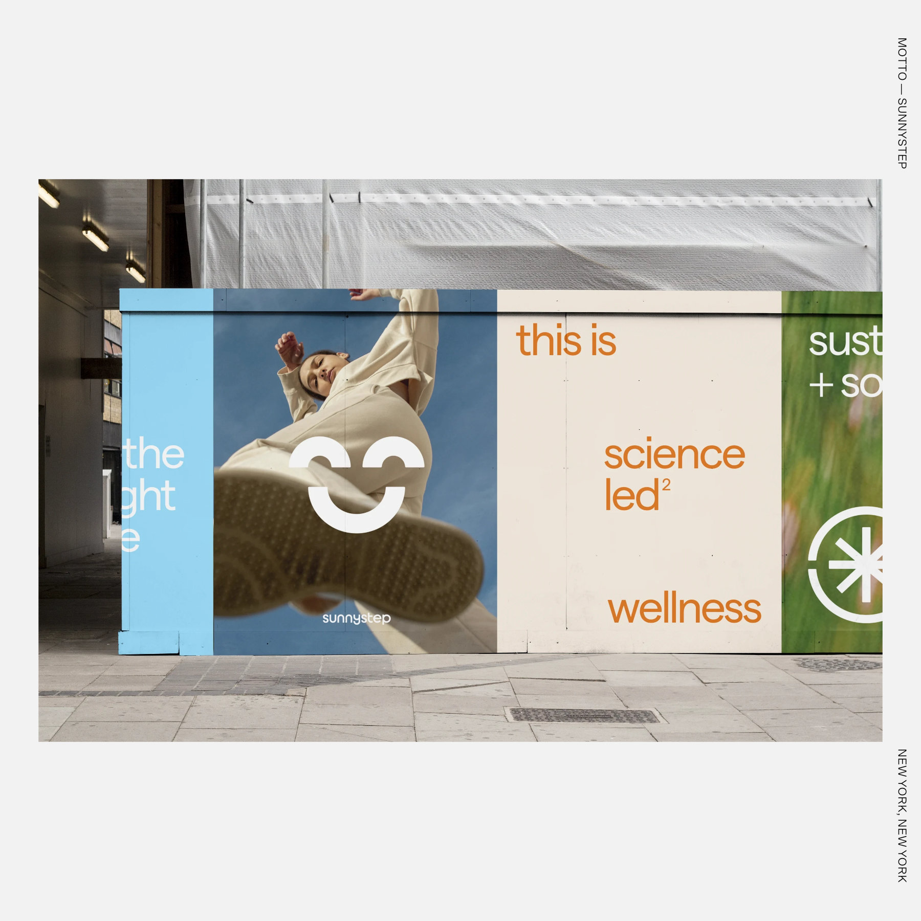 A Sunnystep construction hoarding mural shows a person in a cream outfit stepping toward the camera with a shoe sole in the foreground beside the text “this is science led² wellness.”