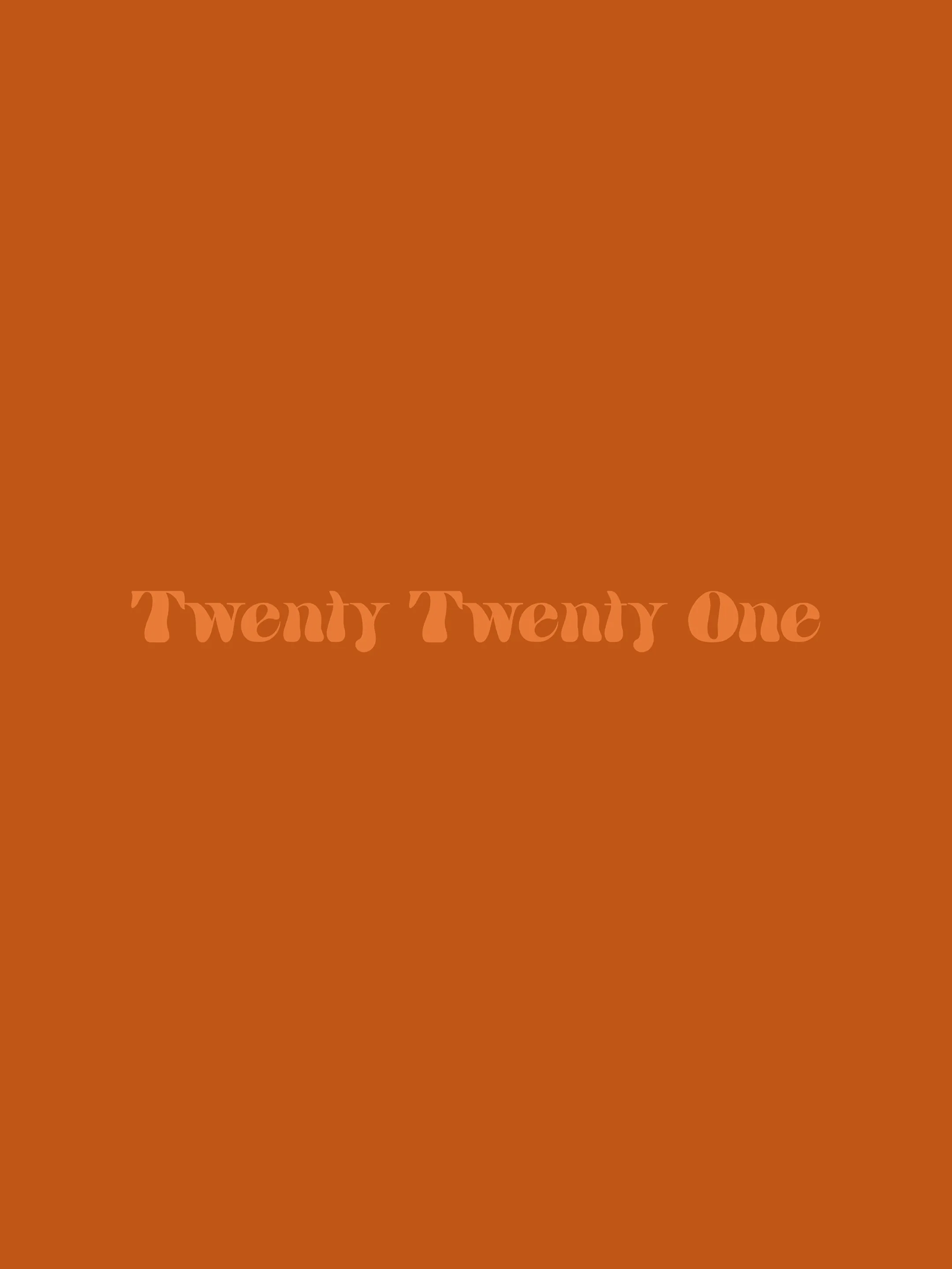 Twenty Twenty One in peach lettering on a burnt-orange background.