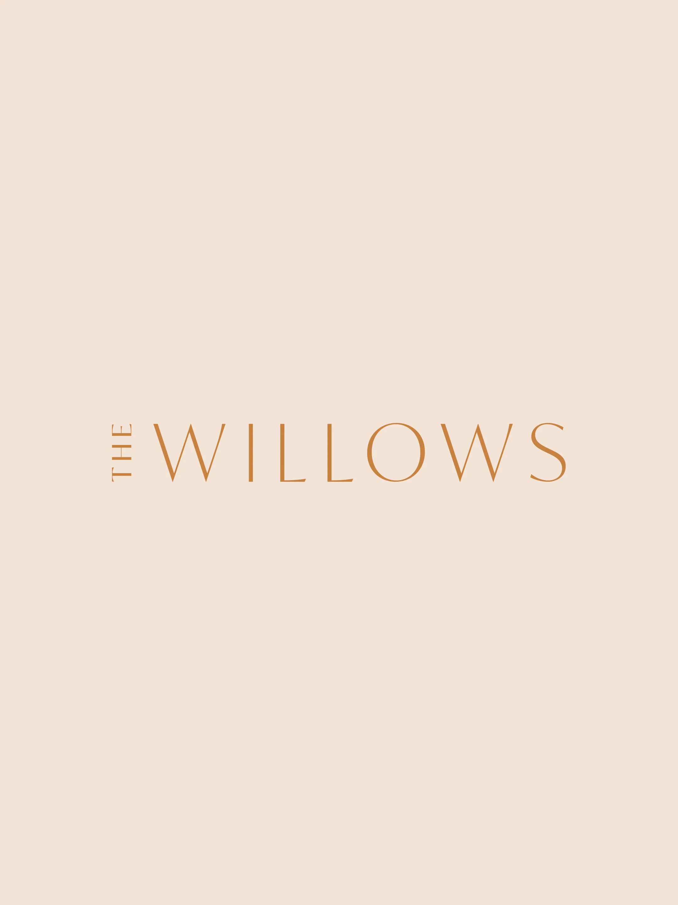 The Willows wordmark in slender bronze-colored lettering on pale peach.