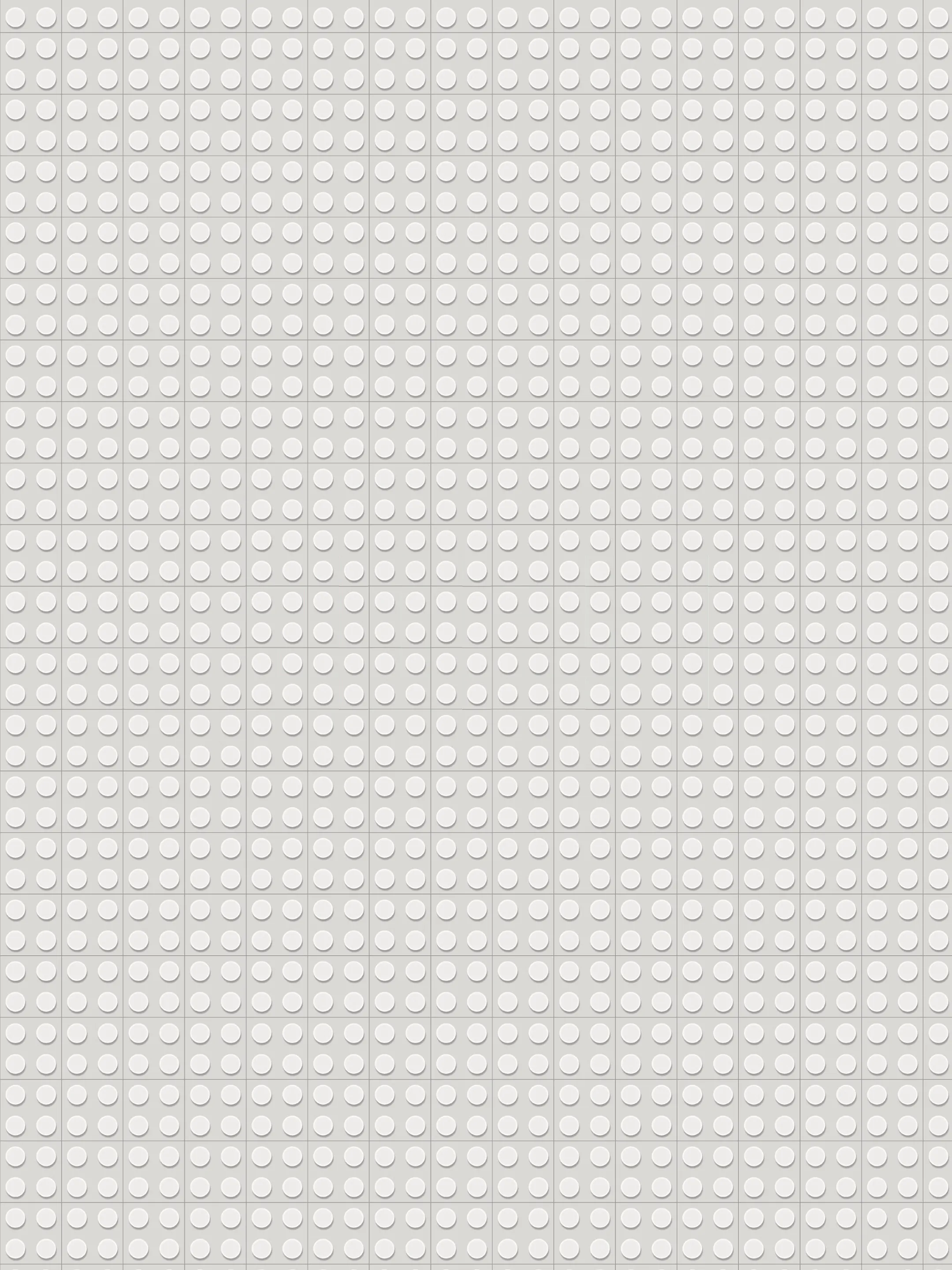 Orange toy bricks snap into place to form “2023” on a grey background.