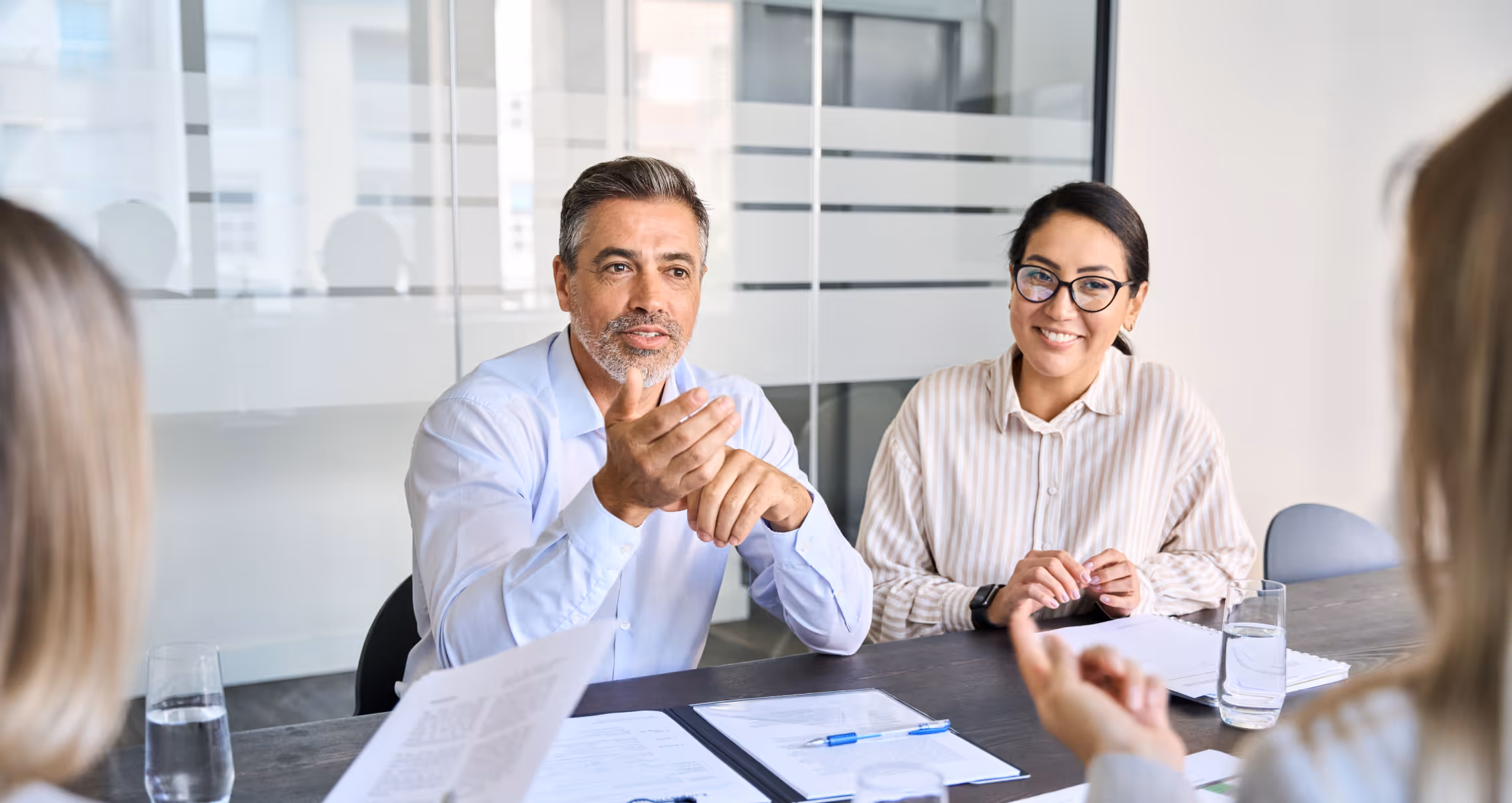 Cleaning business owner reviewing documented SOPs and operating systems with a coach