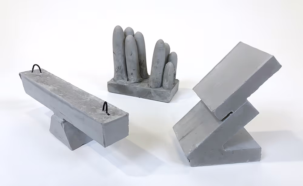 Three Rockite concrete mini sculptures.