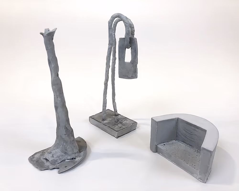 Three Rockite concrete mini sculptures.