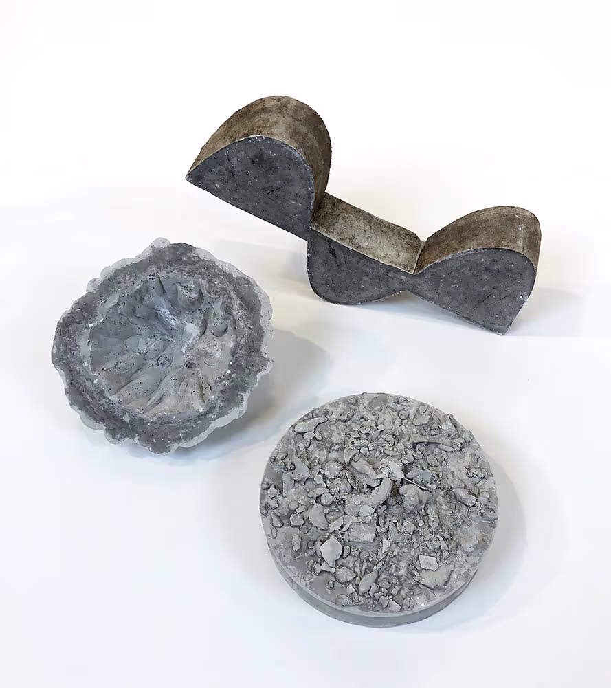 Three Rockite concrete mini sculptures.