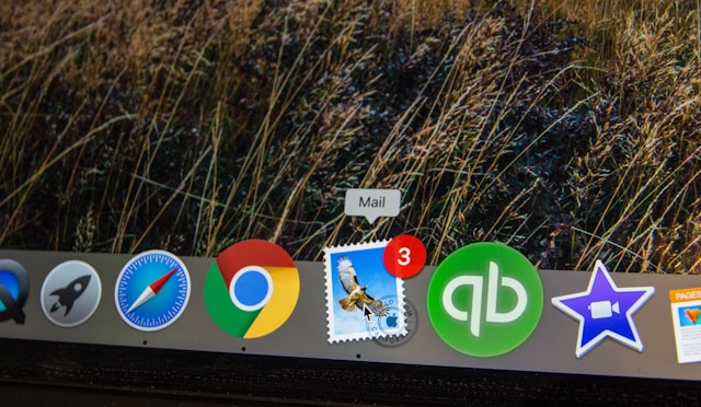 A close-up of a MacBook dock showing the Apple Mail icon with a notification badge, often the first step in diagnosing why Mac Mail is not responding.