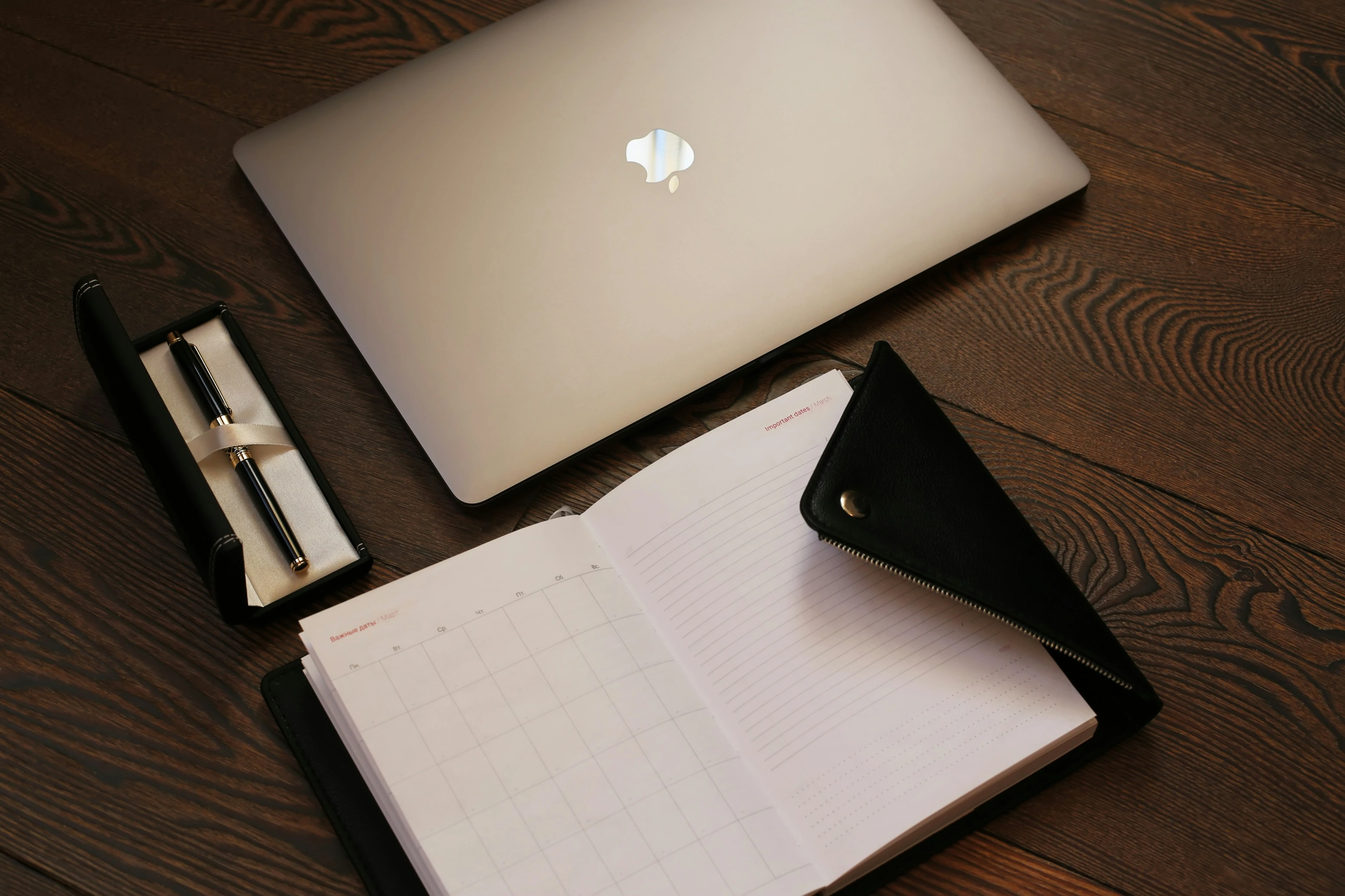 Organized MacBook workspace for managing email efficiently