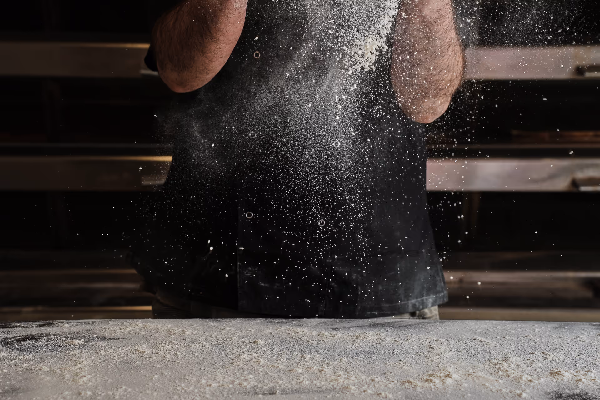Spreading flour all over the table before preparing the dough