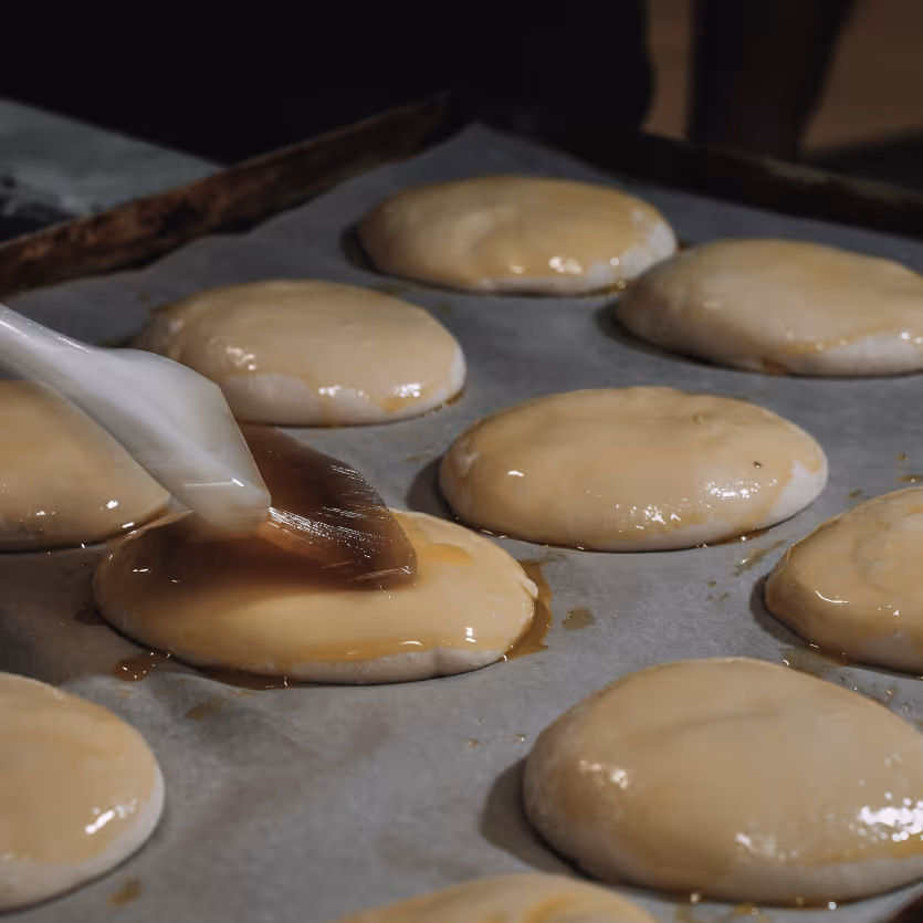 Buttering the dough before the oven