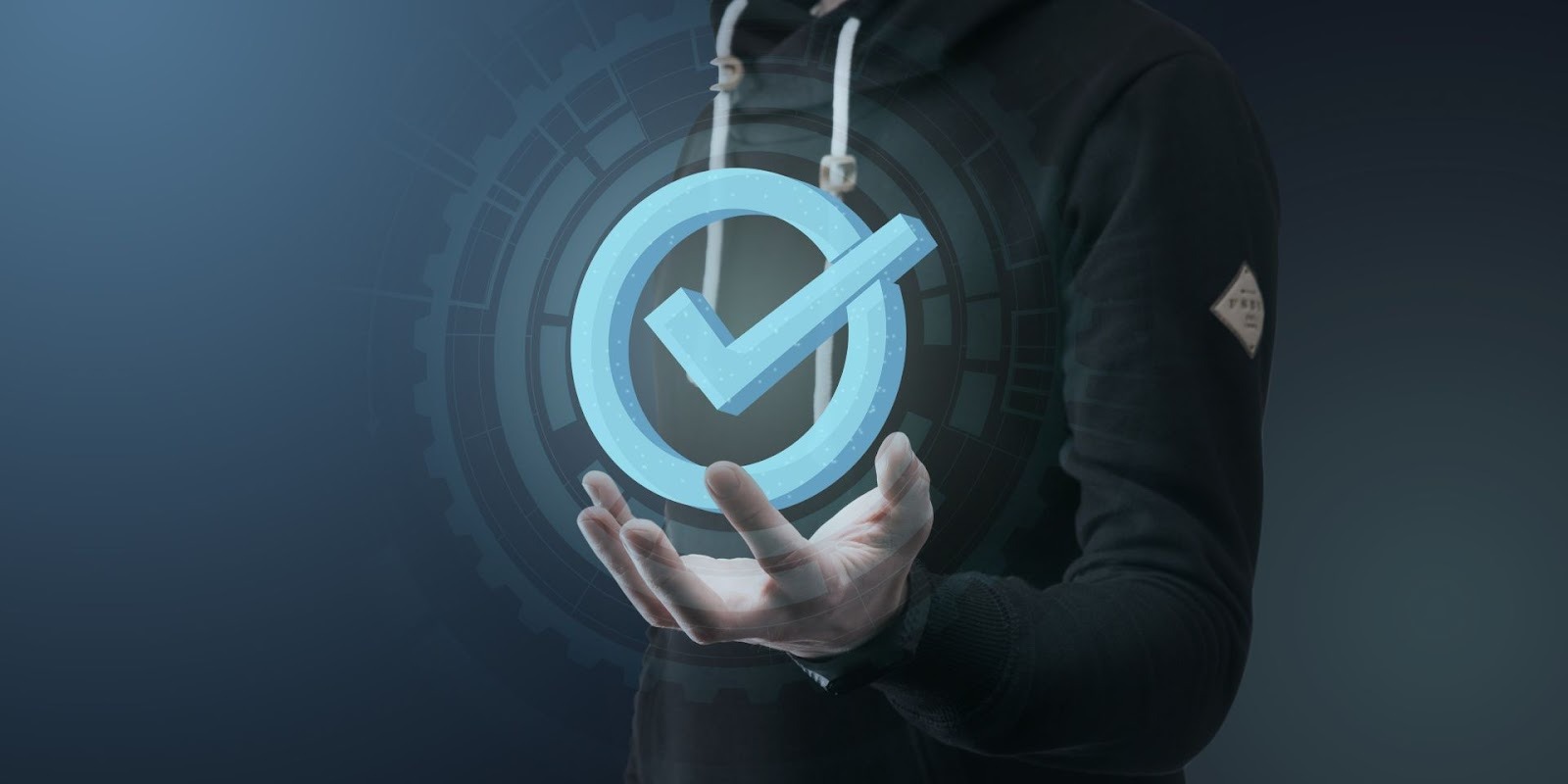 Person holding glowing blue verification checkmark symbol representing digital approval technology