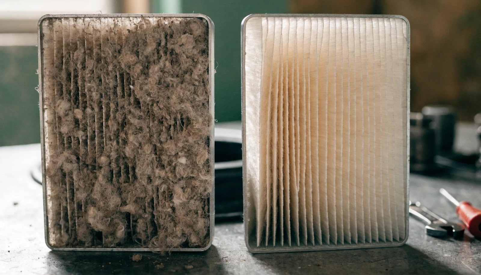 Comparison of dirty and clean HVAC filters indicating maintenance needs