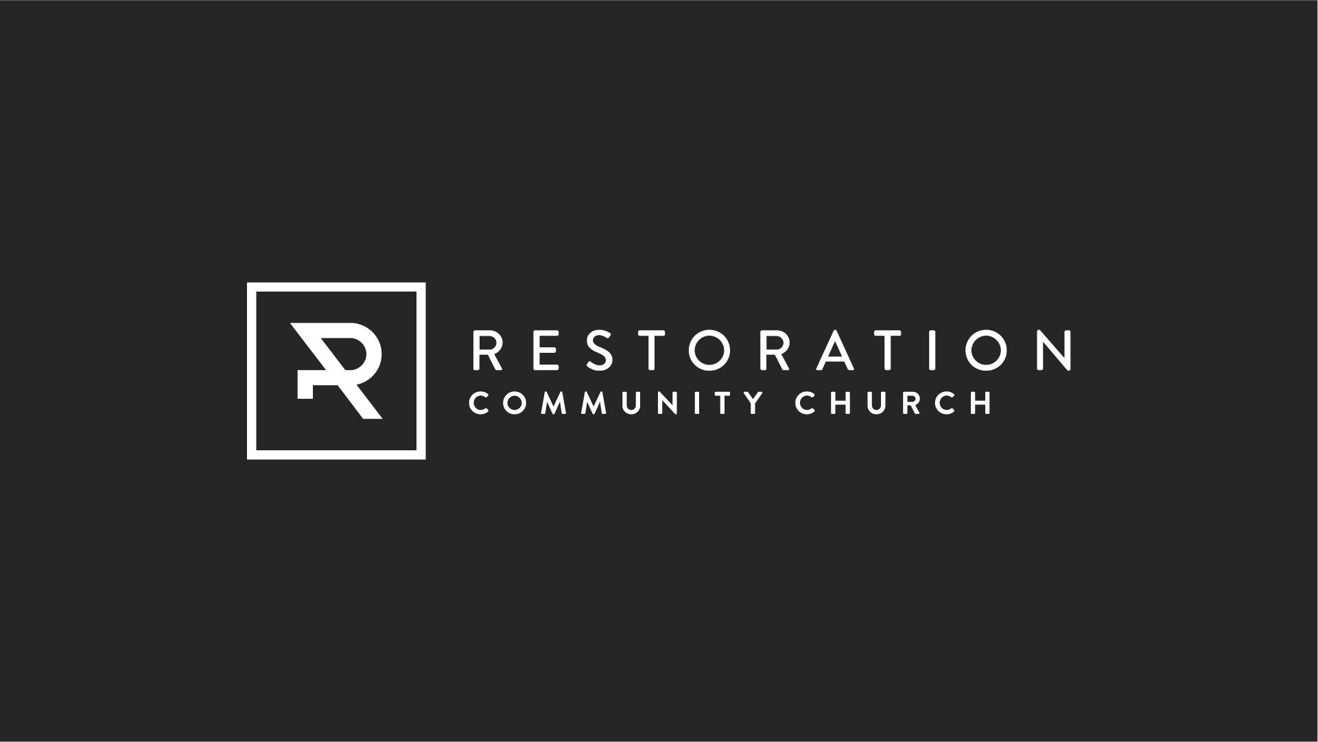 A black background with a white logo in the middle for Restoration Community Church in Mandeville, LA