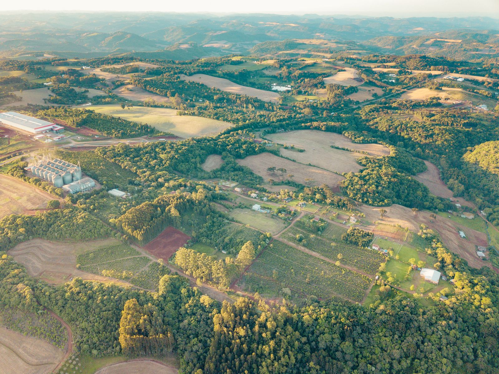 Aerial view of farmland interspersed with patches of native forest in Rio Grande do Sul, Brazil