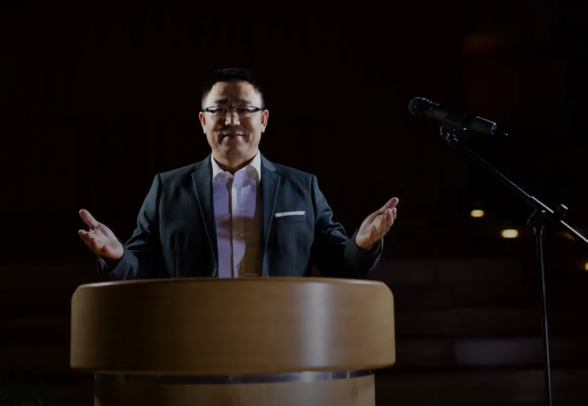 a man addressign peoples