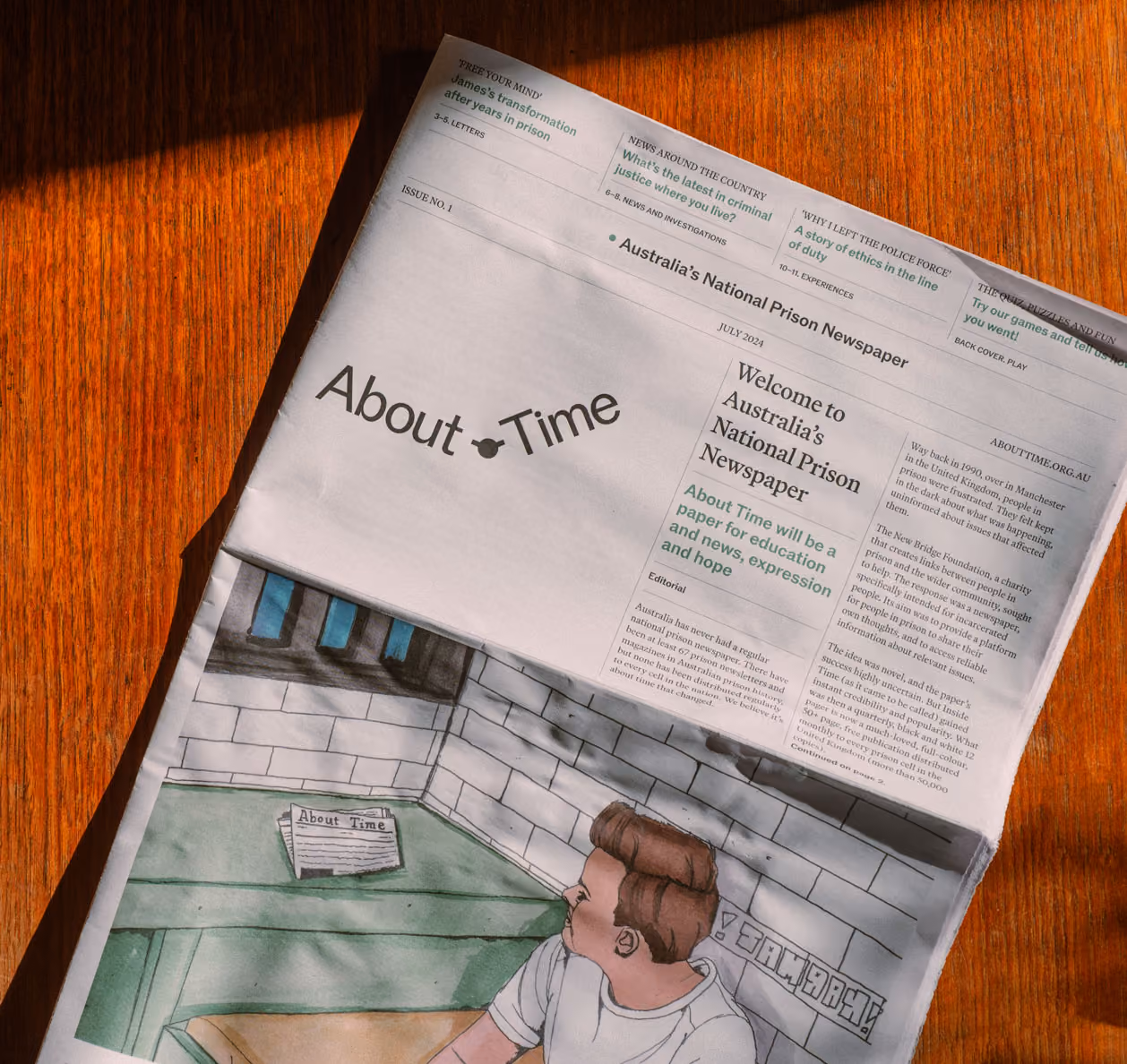 A copy of About Time laying flat on a table top.