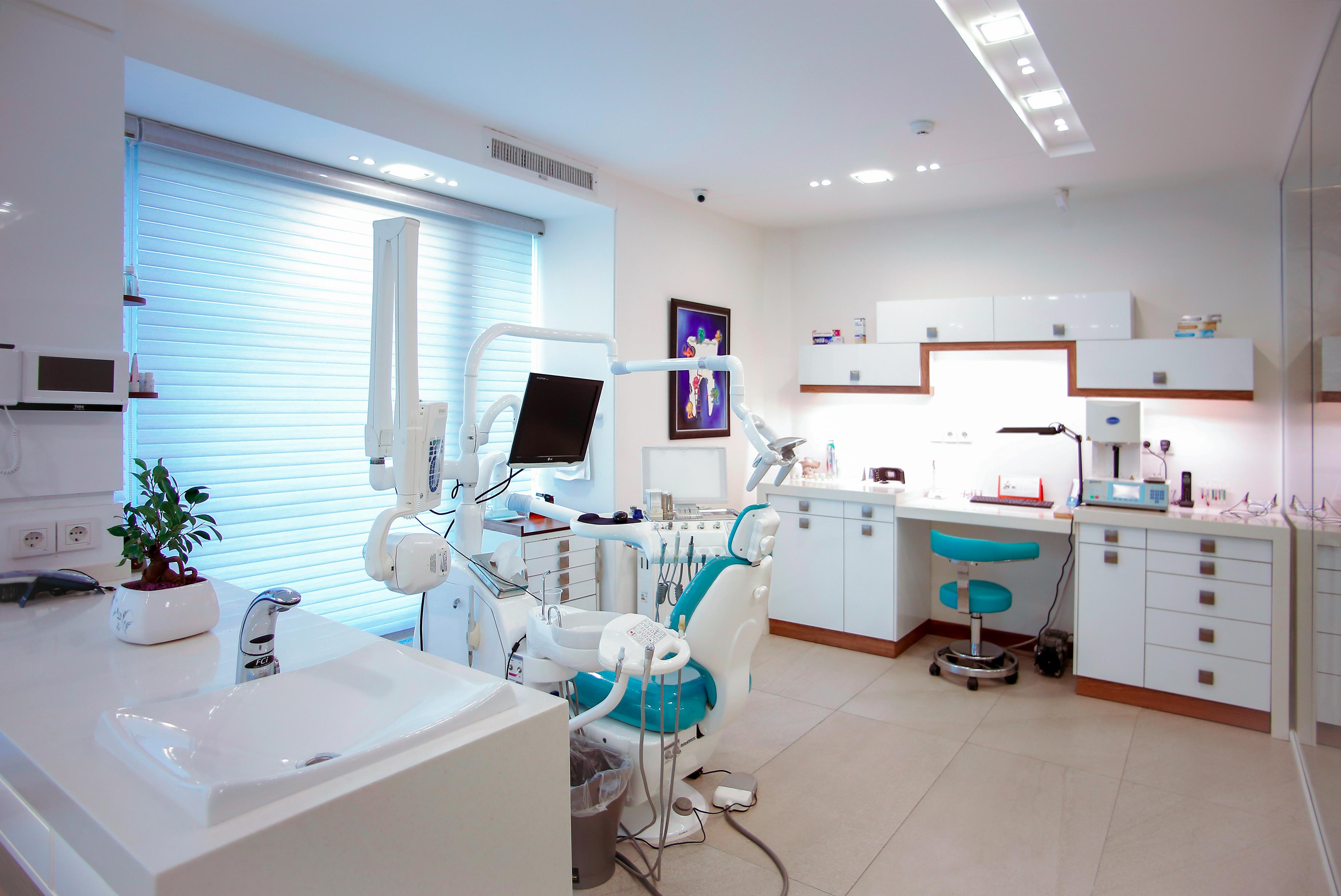 An image of a prison dentist room, with equipment and a chair in the centre.