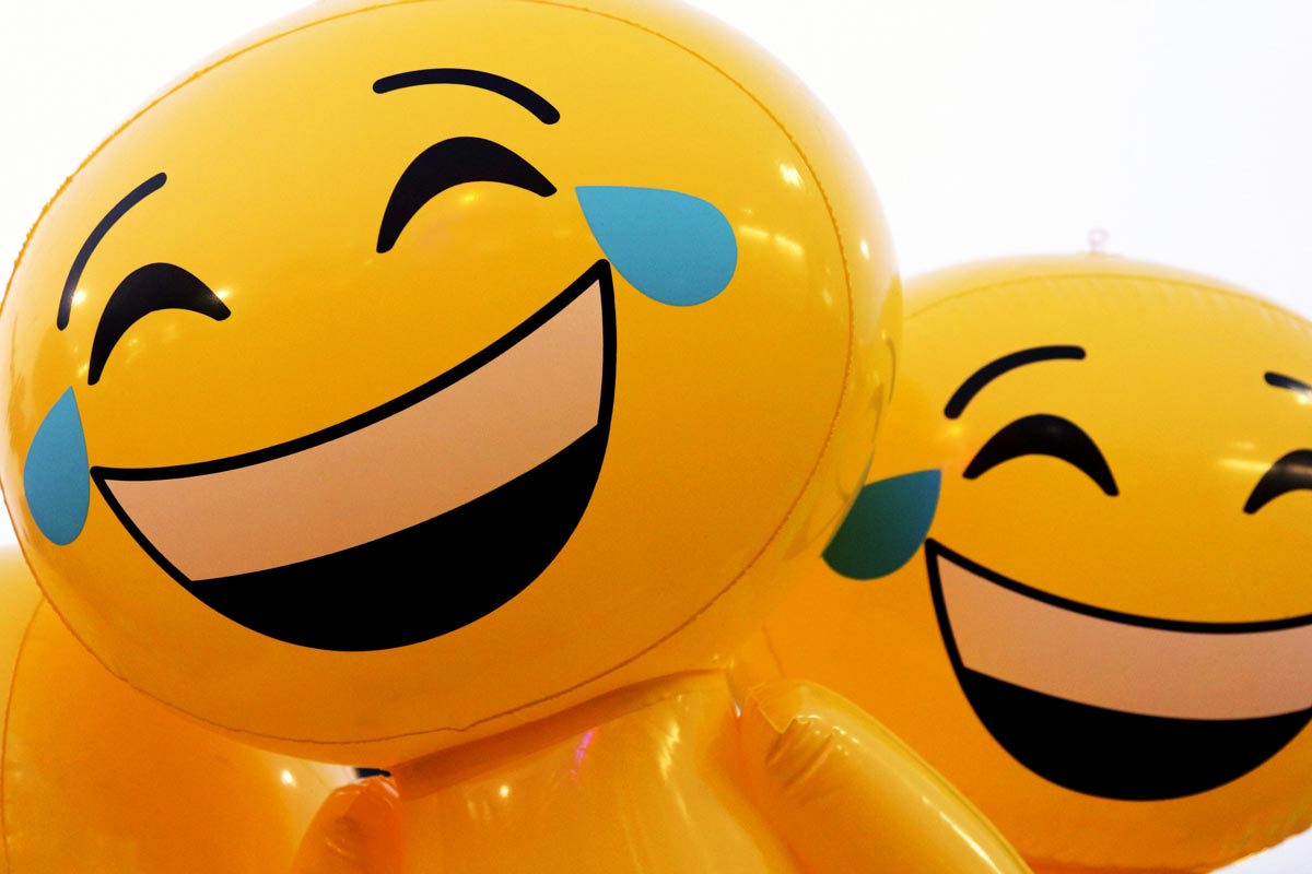 An image of laughing emojis blown up like balloons.