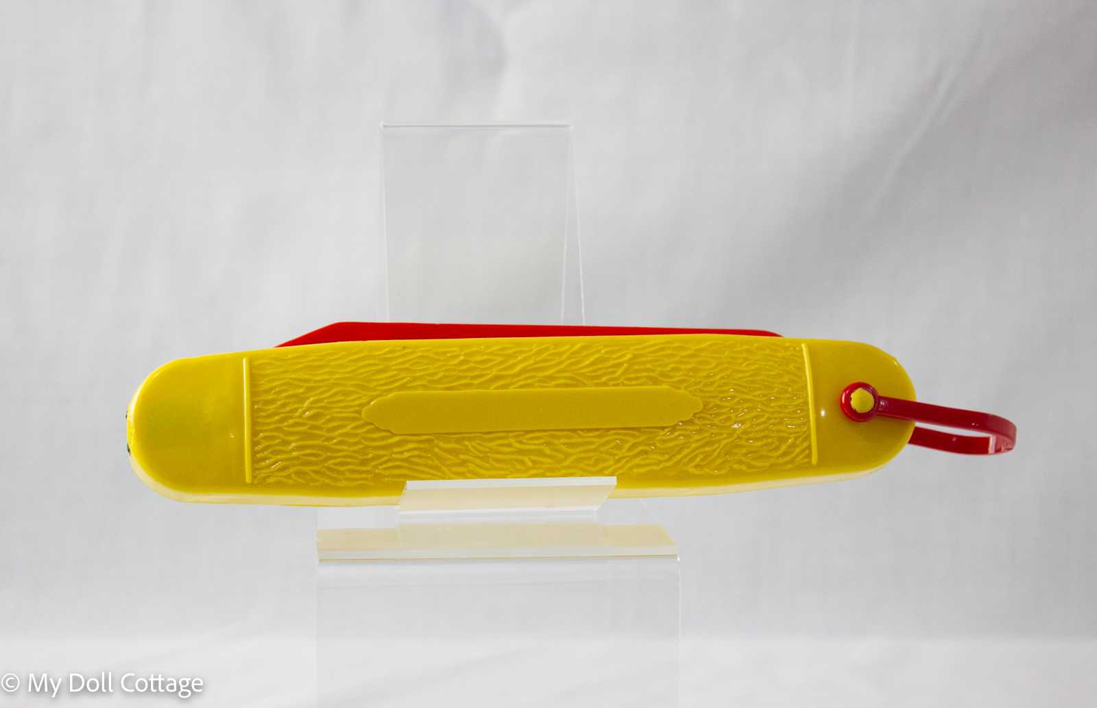 Vintage Dupe Rite F92 yellow plastic pencil case with a sliding red compartment and pivoting red handle, embossed ‘Pencil Case’, retro collectible