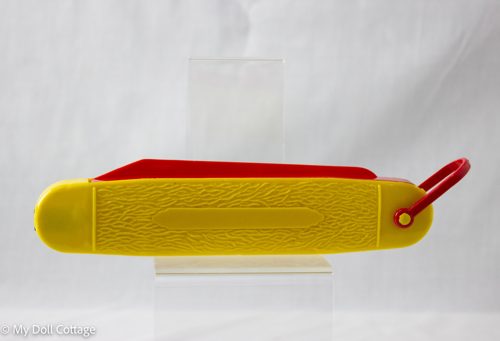 Vintage Dupe Rite F92 yellow plastic pencil case with a sliding red compartment and pivoting red handle, embossed ‘Pencil Case’, retro collectible